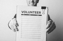 A man signing up to be a volunteer