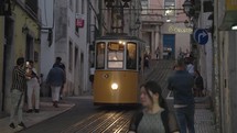 Lisbon, Portugal - The iconic yellow elevador da Bica Funicular in a narrow beautiful alley in the morning Lisbon, Portugal