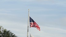 American flag on lowered a flag pole 