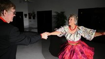 A senior couple ballroom dancing