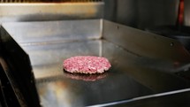 Flipping A Cooking Hamburger On The Grill, Slow Motion