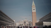 Piazza San Marco, often known in English as St. Mark's Square, is the principal public square of Venice, with the Basilica of Saint Mark and the bell tower in the background.