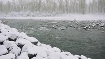 snow along a river shore 
