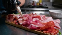 Typical Calabria Dish Preparation Of Cured Meats And Salamis On The Starter