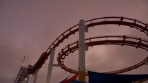 roller coaster at santa monica pier at golden hour