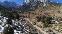 Aerial view of a car driving off road in eastern Sierras in California, near Mount Whitney.