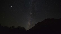 Timelapse of Milky Way stars setting behind a mountain