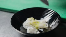 Oil And Salt Over A Bowl With Cuttlefish 