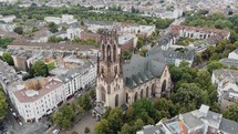 4k Aerial footage circling the historic Saint Martin Church building in Cologne, Germany.