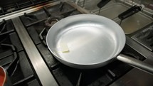 Butter Melting Inside A Frying Pan 