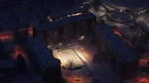 Drone view of kids playing ice hockey during a cold winter night