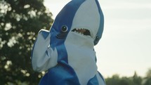 dancing in a shark costume 