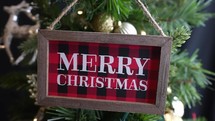 Merry Christmas sign moving on a Christmas Tree Cinemagraph