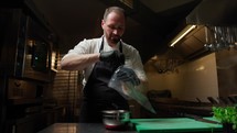 Chef Prepares Sac A Poche With Shrimp Mayonnaise In Cruise Ship Restaurant