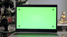Green screen laptop by Christmas Tree