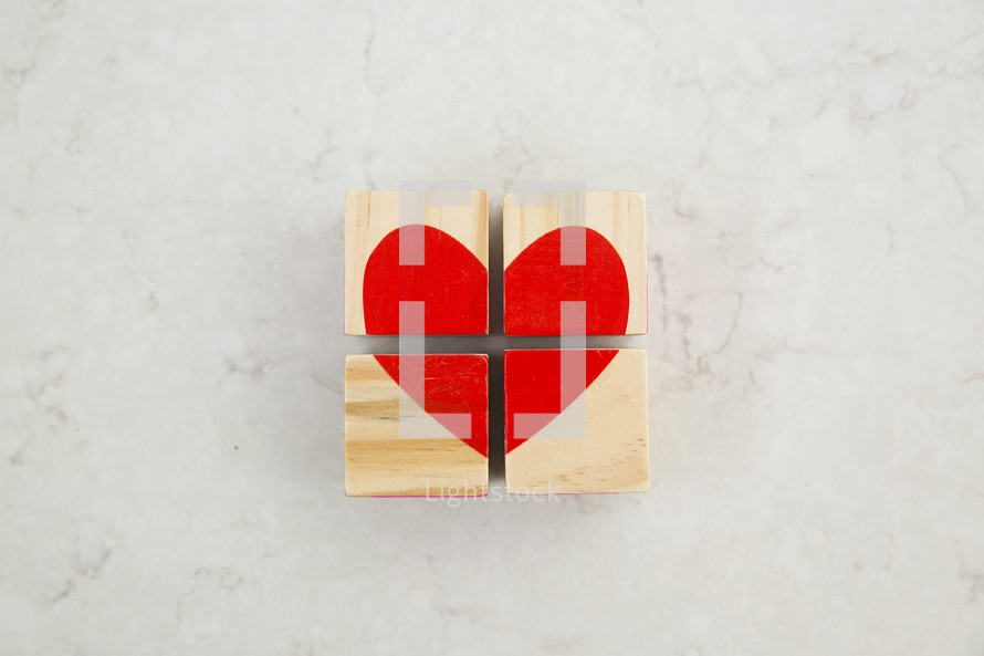 red heart painted on wood blocks 