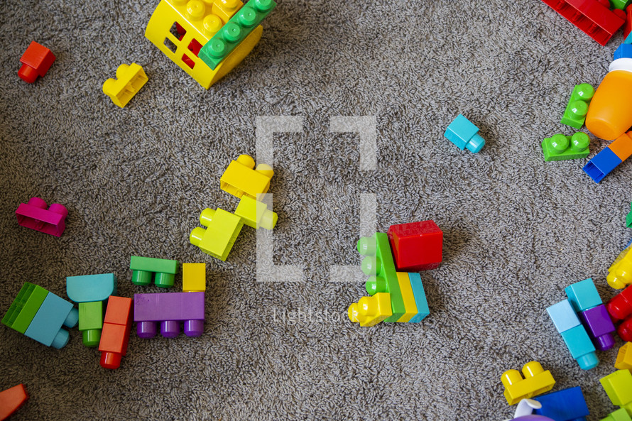 colorful toy blocks on carpet 
