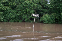 one way sign in a flood 