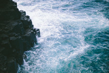 Ocean waves crashing against rocks.