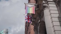 The rainbow LGBTQ flag and attributes on Canal Street, in the Gay Village of Manchester, UK.