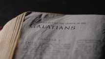 Light revealing a Bible and the book of Galatians