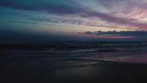 Stunning sunset over sandy beach coastline 