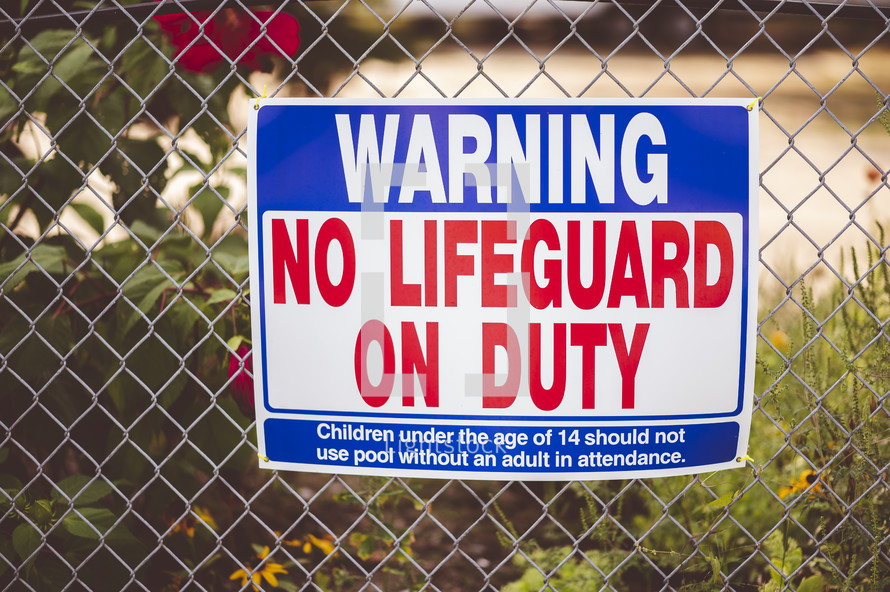 Warning no Life guard on duty sign 