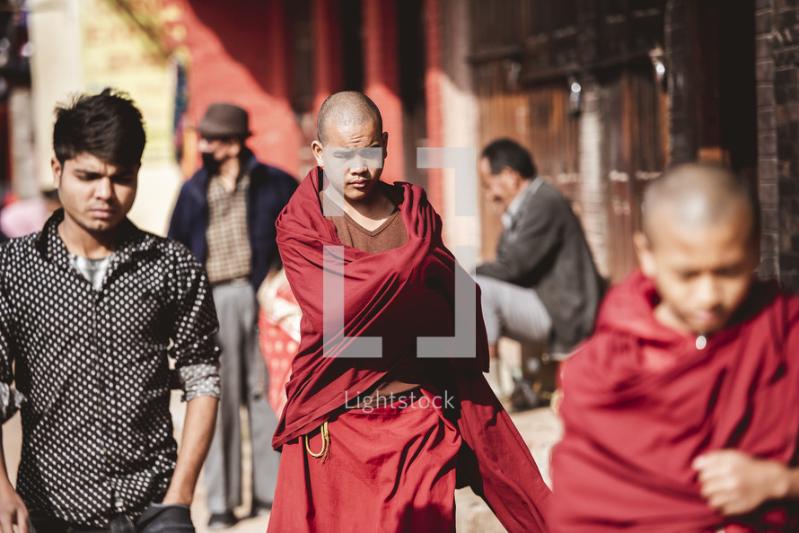 monks walking the streets of Tibet 