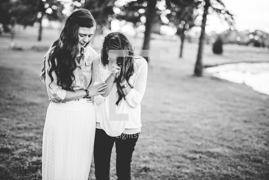 mother and daughter praying together 