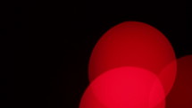 Bokeh - red. Spinning out of focus lights to use in effects.