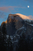 Snowy mountain in Yosemite with moon