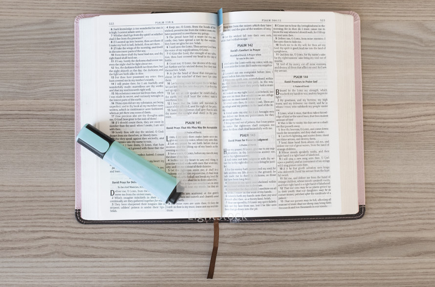 highlighter on the pages of a Bible 