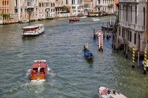 boats and gondolas on the canal in Venice 