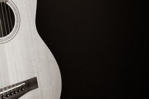 Black and white of guitar on a black background