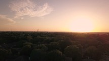 aerial view over a neighborhood at sunset 