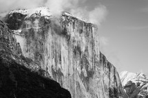Snowy mountain in Yosemite with clouds - black and white