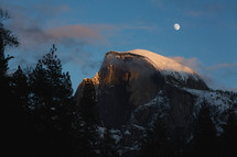 Snowy mountain in Yosemite with moon
