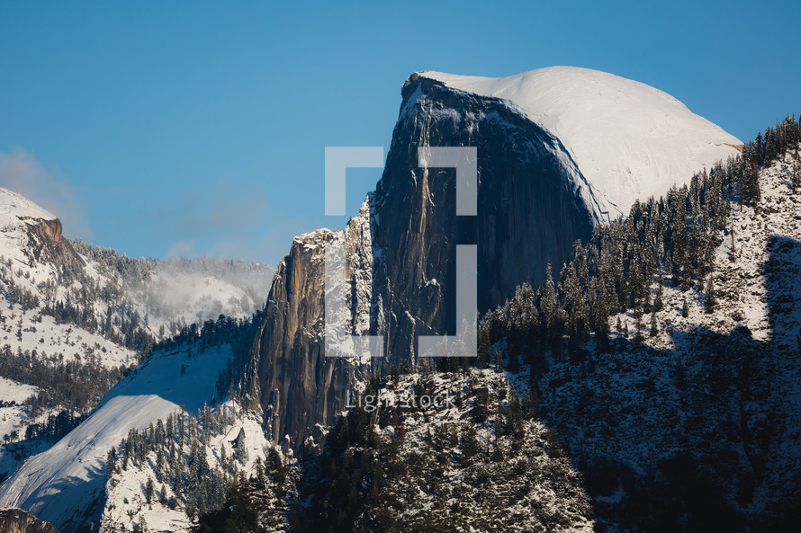 Mountain with snow and trees in Yosemite
