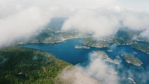 aerial view in the clouds over a lake 