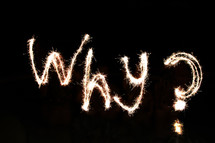"Why" written in fireworks by a team of 'artists' waist-deep in water. 