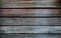 Traffic and weather worn wooden boards