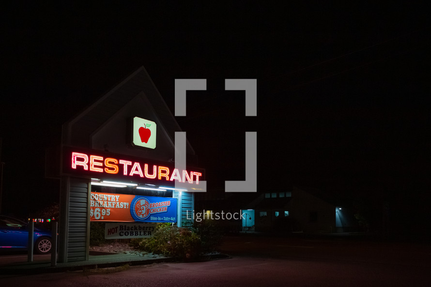 restaurant sign at night 