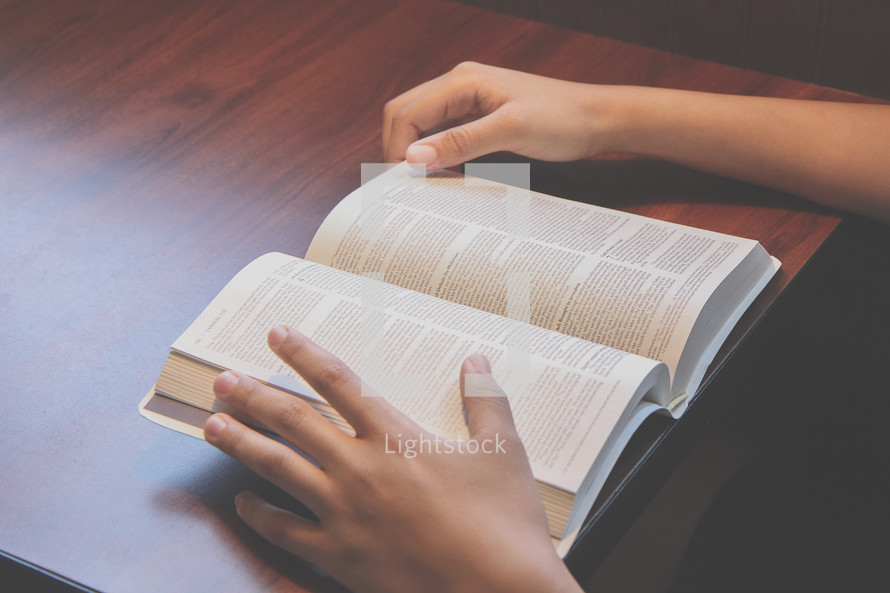 teen girl reading a Bible 