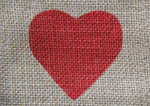 red valentine heart on burlap 