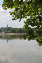 distant steeple across a lake 