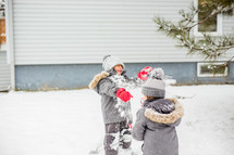 kids playing in the snow 
