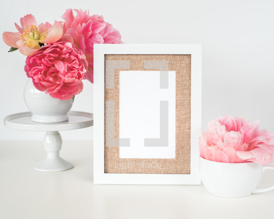 pink flowers, blank frame, and, mug on a white background 