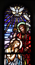 stained glass window of Jesus praying 