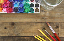 art supplies on a wood background 