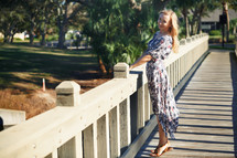 woman standing on a wooden bridge in Florida 